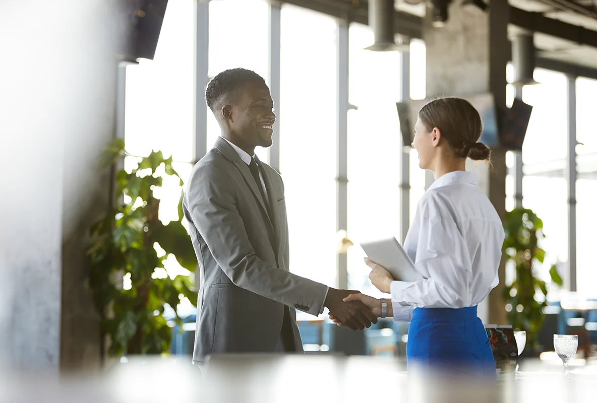 business man is shaking hands with customer